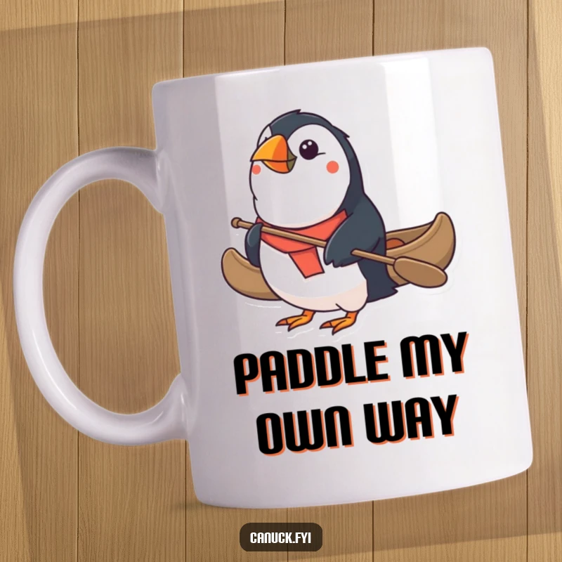 Funny Puffin Mug: Dashing puffin determinedly paddles a miniature canoe, embodying a spirit of adventure and resilience. A comical gift.