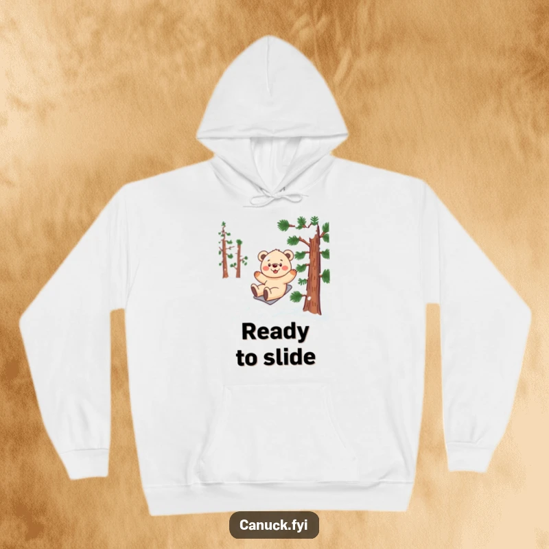 Funny bear cub hoodie depicting a smiling cub gleefully sliding down a snow-covered, stylized pine tree.