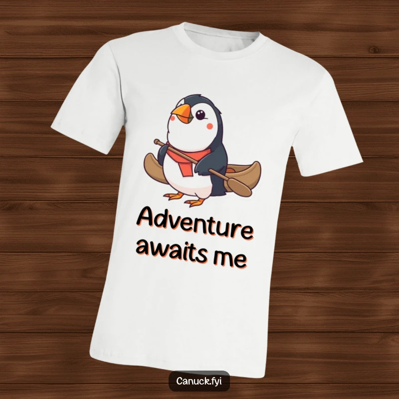 Funny Puffin T-Shirt: A determined puffin paddles a small canoe with great focus, perfect for bird lovers and humor enthusiasts. Excellent funny gift.