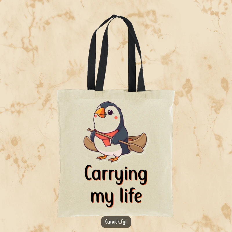 Funny Puffin Tote Bag: A determined puffin expertly paddles a tiny canoe, ready for errands or adventures. A charming and funny gift.