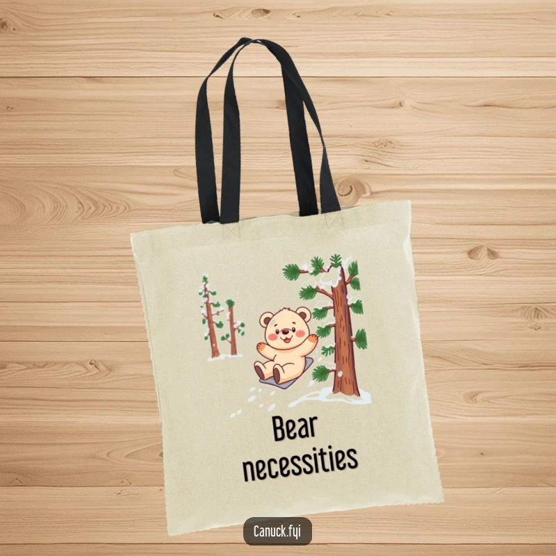 Funny bear cub tote bag featuring a smiling cub gleefully sliding down a stylized, snow-covered pine tree.