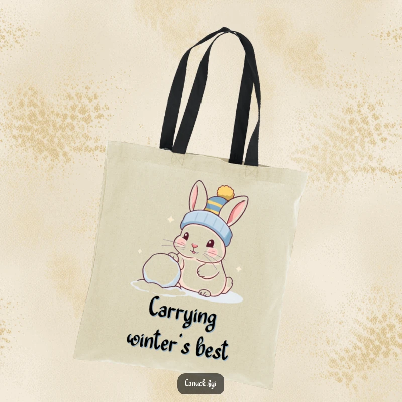 Funny rabbit wearing a toque, playfully nudging a snowball, durable tote bag, perfect for shopping.